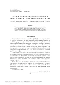 On the Semicontinuity of the Mod 2 Spectrum of Hypersurface Singularities