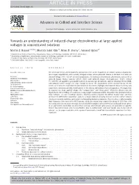 Towards an Understanding of Induced-Charge Electrokinetics at Large Applied Voltages in Concentrated Solutions