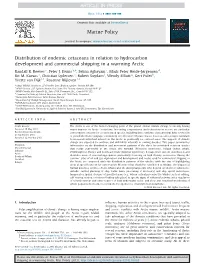 Distribution of Endemic Cetaceans in Relation to Hydrocarbon Development and Commercial Shipping in a Warming Arctic