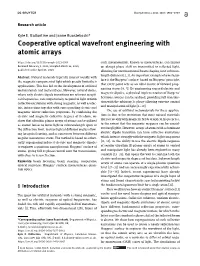 Cooperative Optical Wavefront Engineering with Atomic Arrays