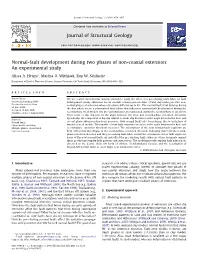 Normal-Fault Development During Two Phases of Non-Coaxial Extension: an Experimental Study