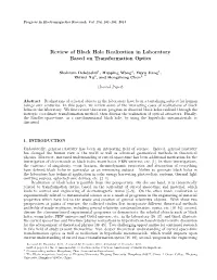 Review of Black Hole Realization in Laboratory Based on Transformation Optics