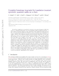Complete Homotopy Invariants for Translation Invariant Symmetric Quantum Walks on a Chain