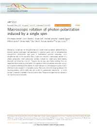 Macroscopic Rotation of Photon Polarization Induced by a Single Spin