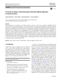 A Review on Animal–Robot Interaction: from Bio-Hybrid Organisms to Mixed Societies