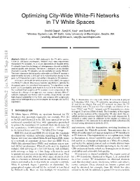 Optimizing City-Wide White-Fi Networks in TV White Spaces